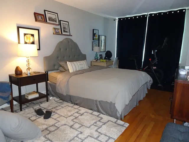 a living room with furniture kitchen view and a fireplace