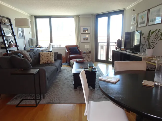 a kitchen with stainless steel appliances granite countertop white cabinets and a granite counter tops