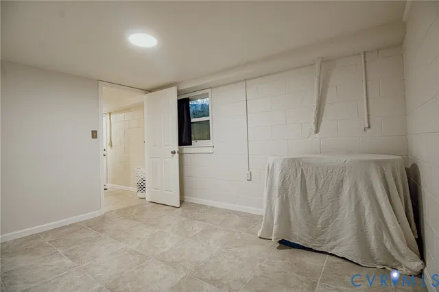 a view of a storage & utility room with a sink