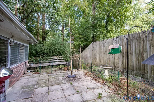 a view of a backyard with a swing