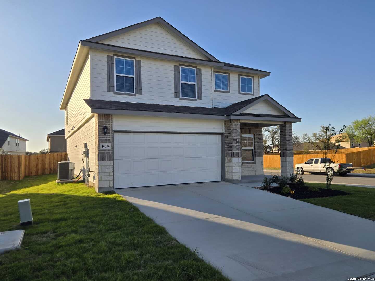 14674 Clay Rdg Run San Antonio, TX 78253 - Photo 4 of 14 a front view of a house with a yard and garage