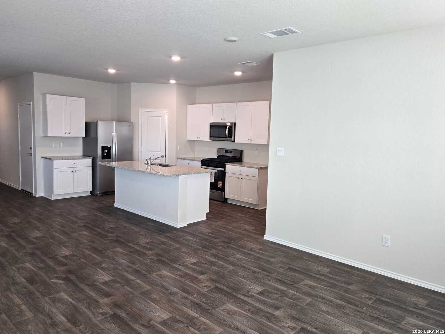14674 Clay Rdg Run San Antonio, TX 78253 - Photo 5 of 14 a view of kitchen with wooden floor and electronic appliances