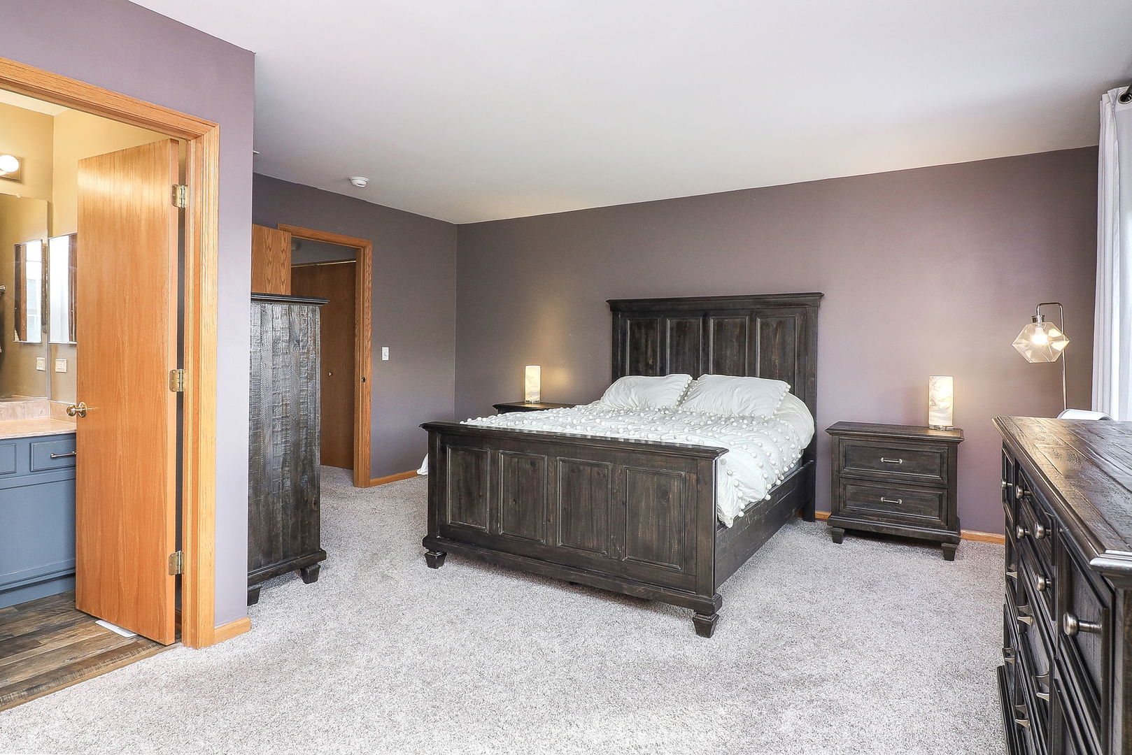 1914 Austrian Pine Street Lockport, IL 60441 - Photo 11 of 17 a bed sitting in a room next to a lamp