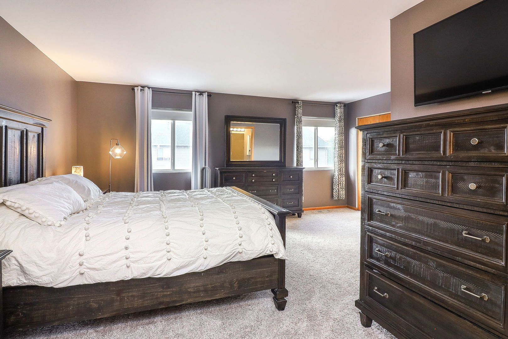 1914 Austrian Pine Street Lockport, IL 60441 - Photo 12 of 17 a spacious bedroom with a bed and a flat screen tv