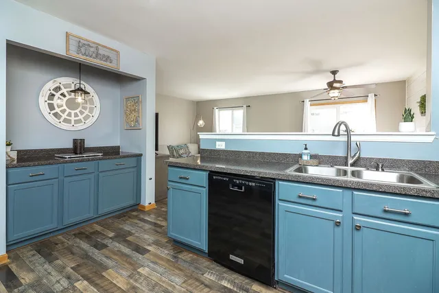 a kitchen with a sink and a stove