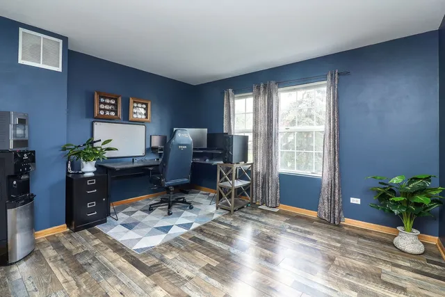 a workspace with furniture window and a potted plant