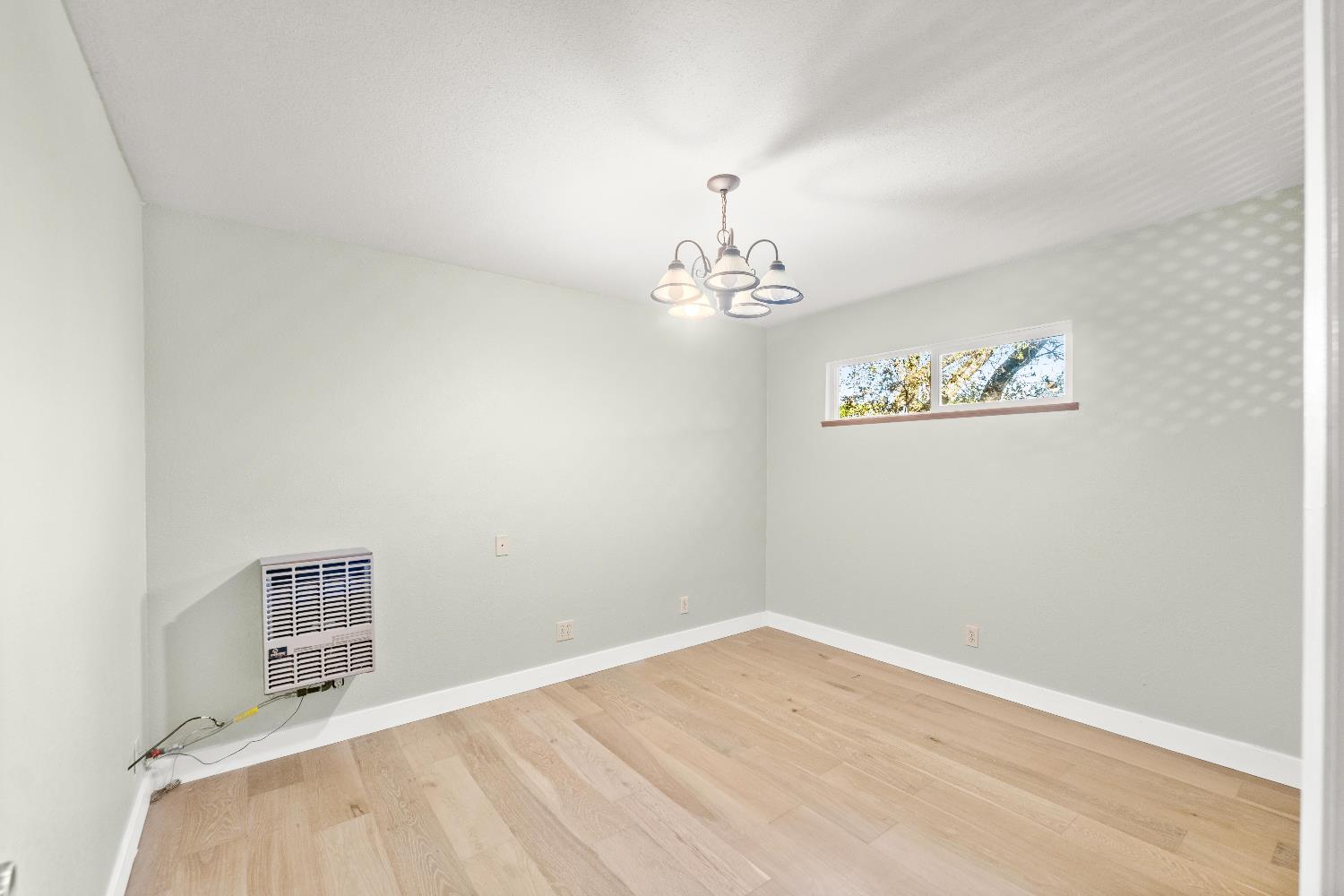 18330 Hummingbird Drive Penn Valley, CA 95946 - Photo 36 of 62 a view of a room with wooden floor and window