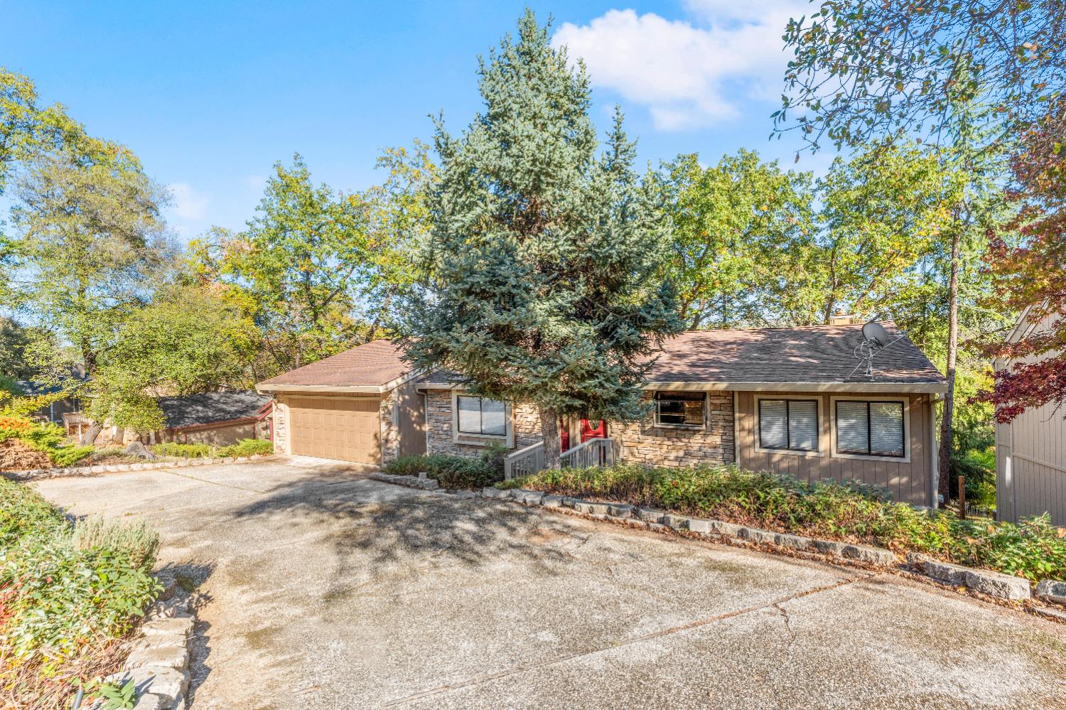 18330 Hummingbird Drive Penn Valley, CA 95946 - Photo 61 of 62 a front view of a house with a yard and tree s