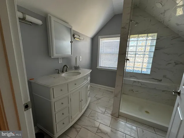 a bedroom with bed and window