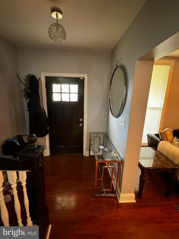 a kitchen with stainless steel appliances granite countertop a sink a stove a microwave a sink a refrigerator and white cabinets