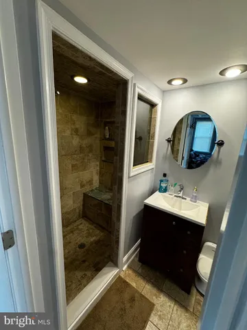 a view of a livingroom with furniture hardwood floor and a window