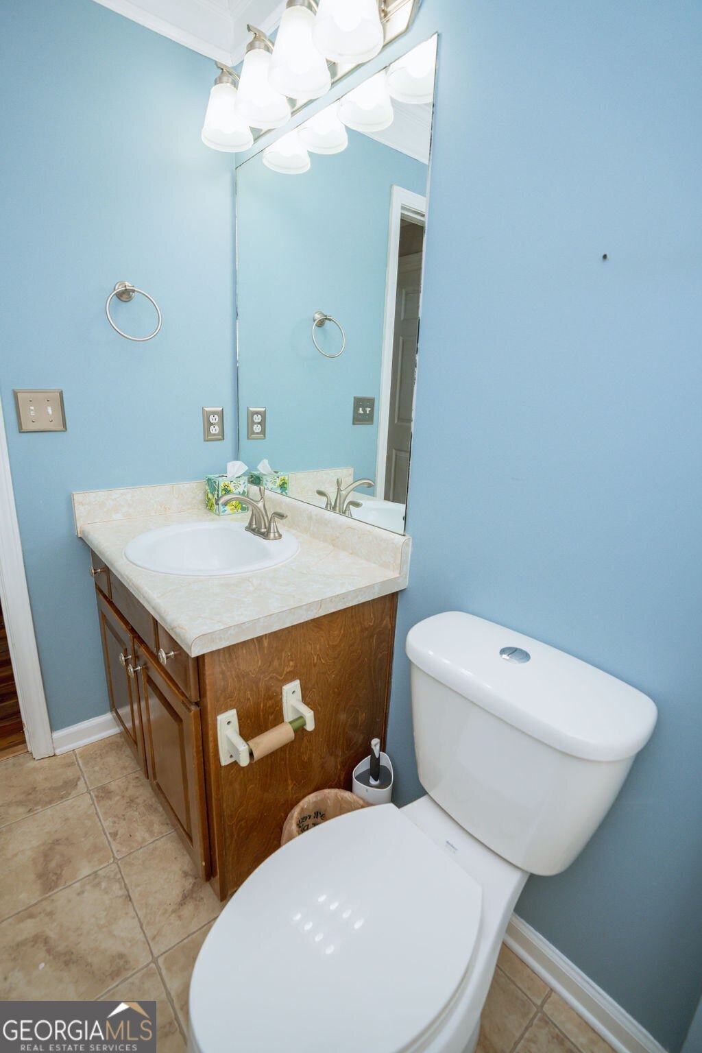 211 Sunfish Trail Southwest Eatonton, GA 31024 - Photo 29 of 40 a bathroom with a sink a mirror and a toilet