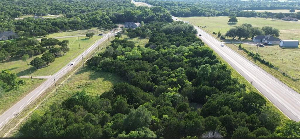1129 County Road Nemo, TX 76070 - Photo 2 of 29 a view of a yard with a lake view