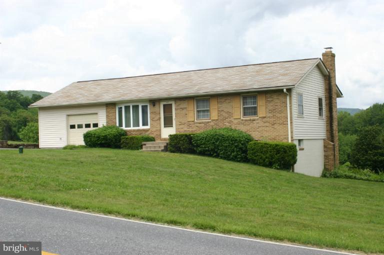 8422 Edgewood Church Road Frederick, MD 21702 - Photo 2 of 17 a front view of a house with a garden