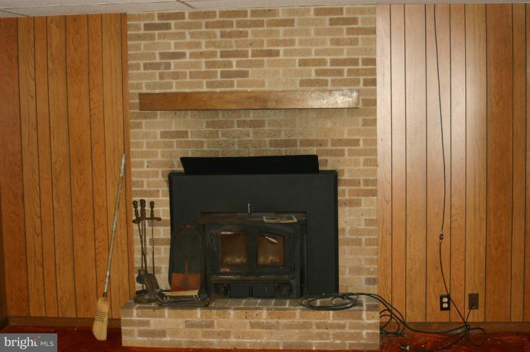 8422 Edgewood Church Road Frederick, MD 21702 - Photo 11 of 17 a living room with a fireplace