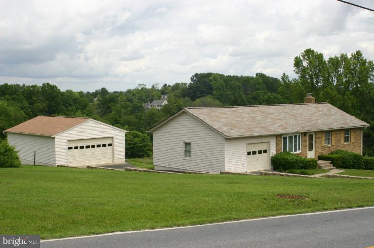 8422 Edgewood Church Road Frederick, MD 21702 - Photo 4 of 17 a aerial view of a house next to a yard and large trees