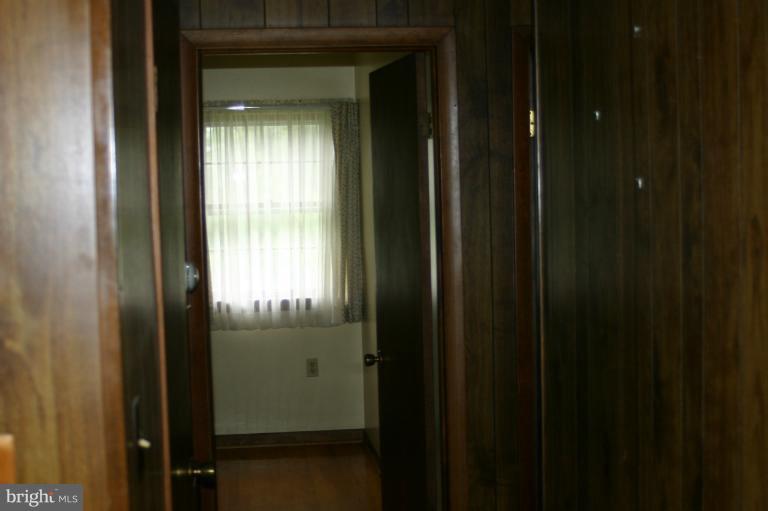 8422 Edgewood Church Road Frederick, MD 21702 - Photo 10 of 17 a view of a bathroom from a hallway