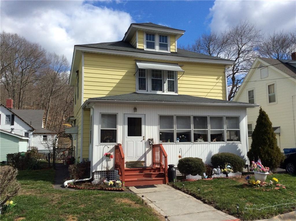 41 Spring Garden Avenue Norwich, CT 06360 - Photo 1 of 1 a front view of a house with a yard