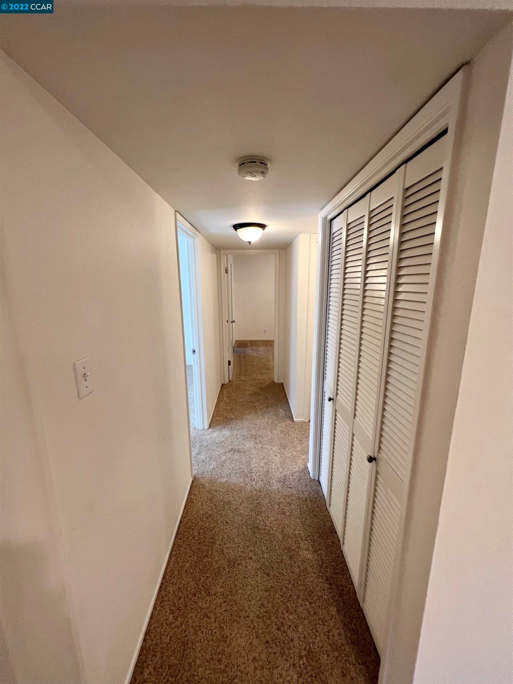 2060 Camel Lane Walnut Creek, CA 94596 - Photo 11 of 33 a view of a hallway with wooden floor