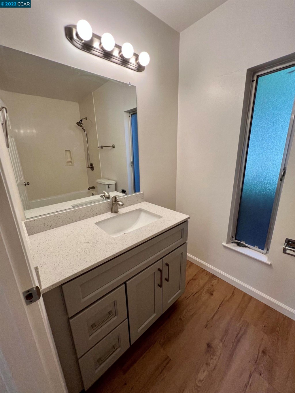 2060 Camel Lane Walnut Creek, CA 94596 - Photo 15 of 33 a bathroom with a sink double vanity and a mirror