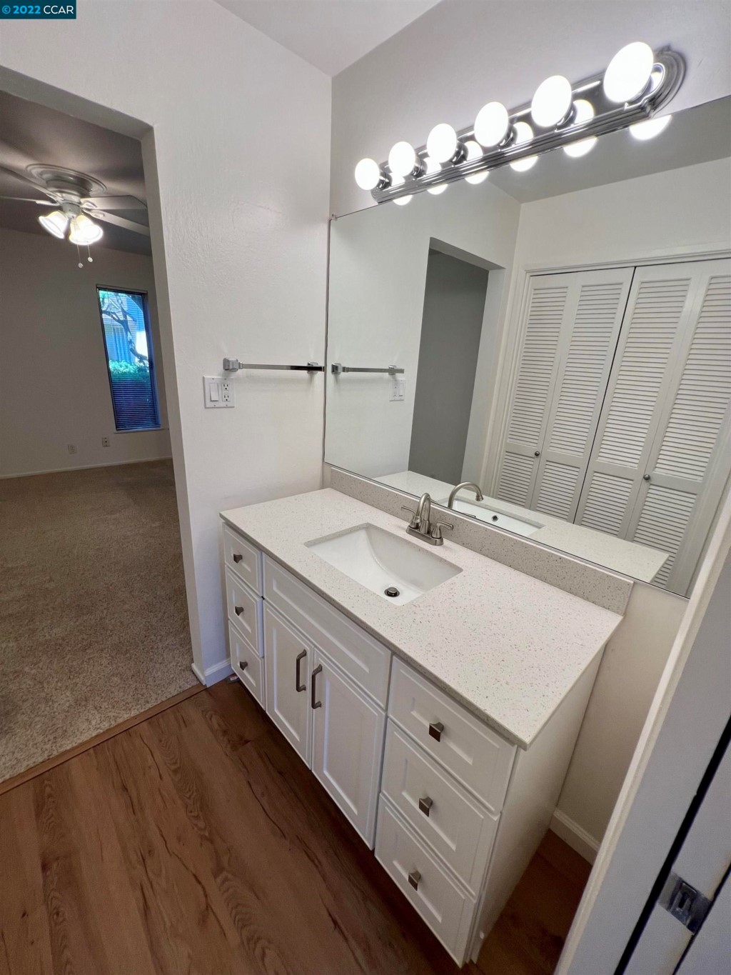 2060 Camel Lane Walnut Creek, CA 94596 - Photo 25 of 33 a bathroom with a double vanity sink and a mirror