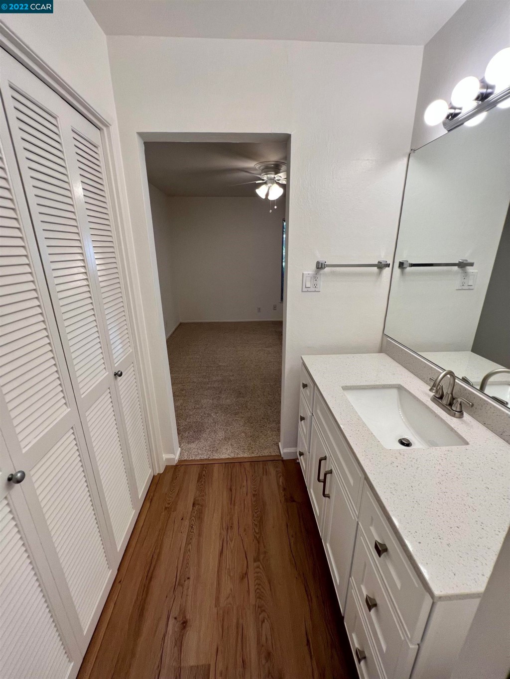 2060 Camel Lane Walnut Creek, CA 94596 - Photo 26 of 33 a bathroom with a sink a mirror and a shower