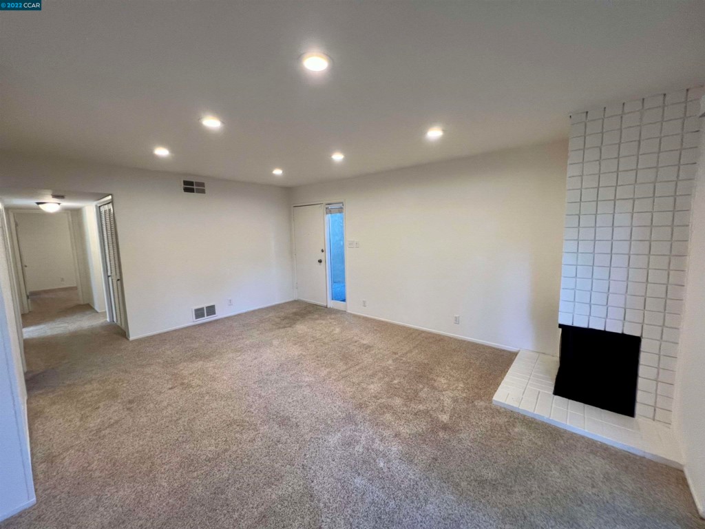 2060 Camel Lane Walnut Creek, CA 94596 - Photo 4 of 33 an empty room with fireplace
