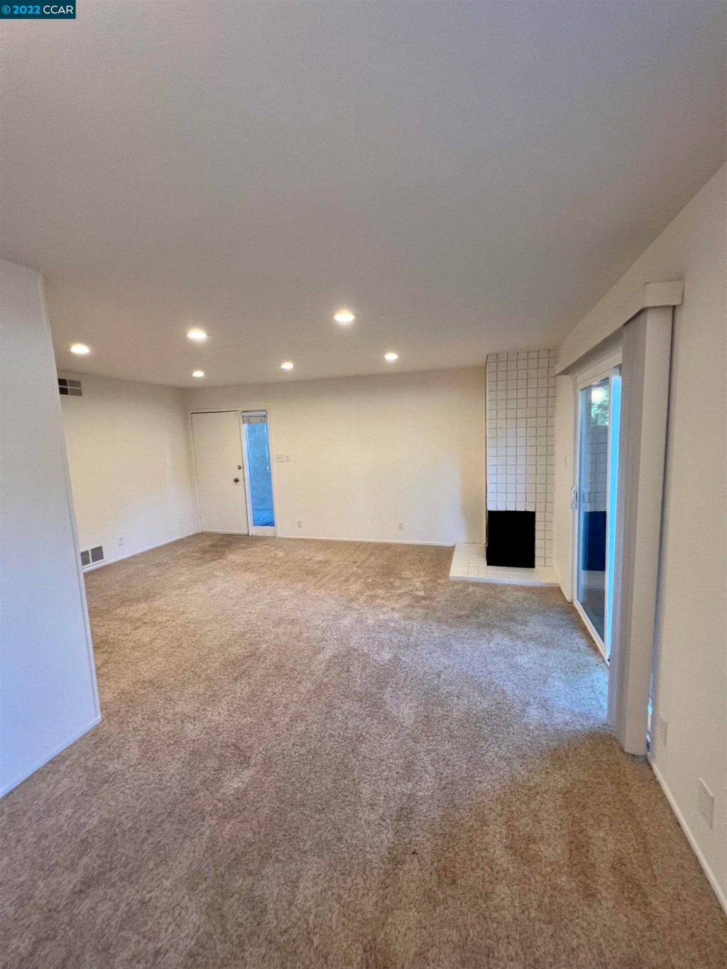 2060 Camel Lane Walnut Creek, CA 94596 - Photo 5 of 33 a view of an empty room with wooden floor and windows