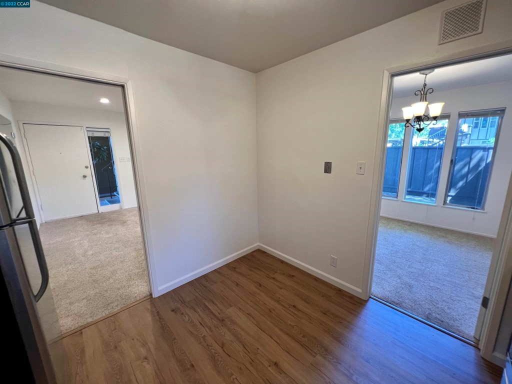 2060 Camel Lane Walnut Creek, CA 94596 - Photo 10 of 33 wooden floor in an empty room with a mirror