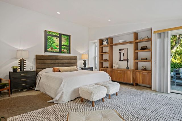 a bedroom with a bed and a couch