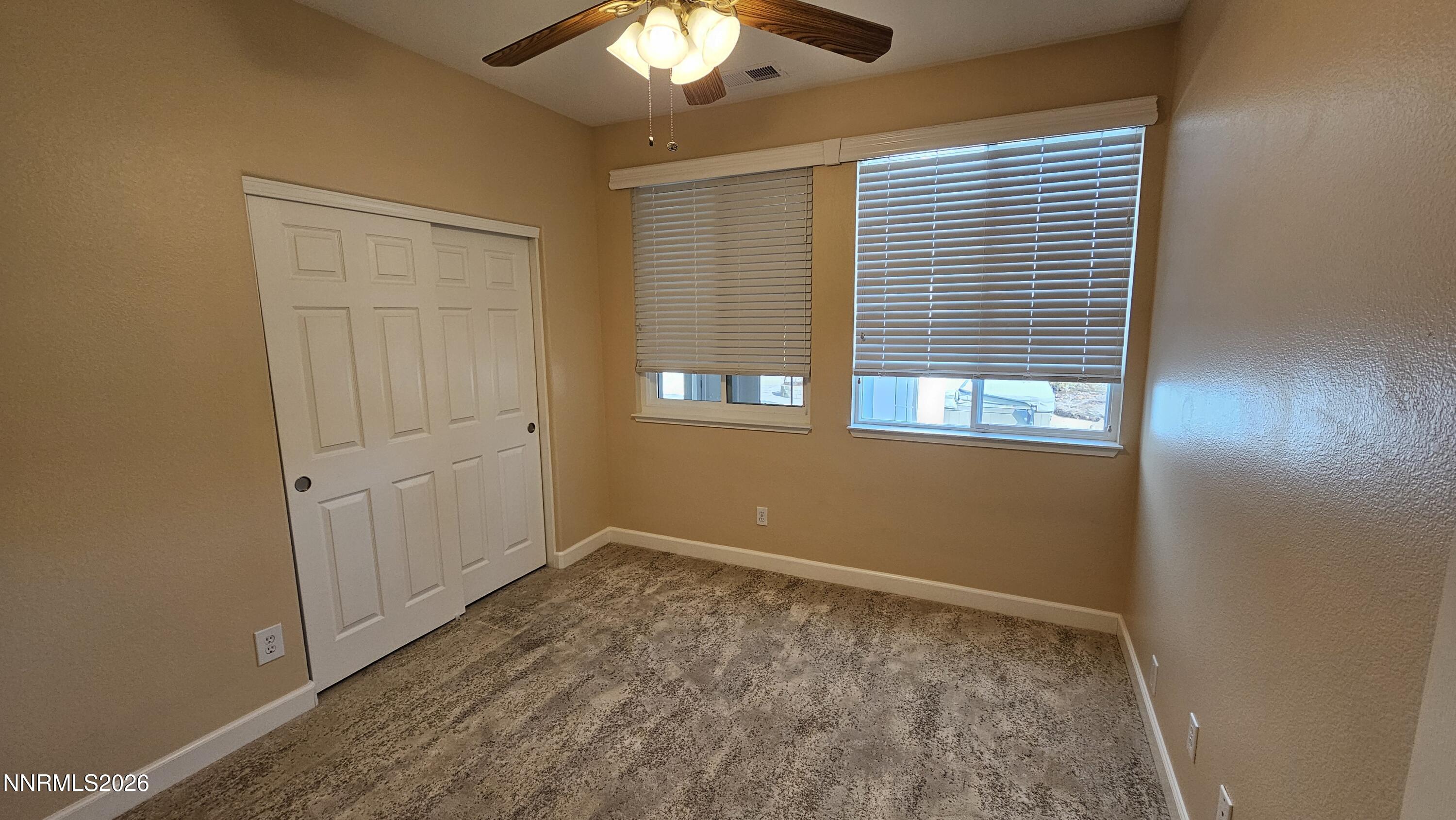 3933 Border Court Reno, NV 89508 - Photo 17 of 36 an empty room with wooden floor and windows