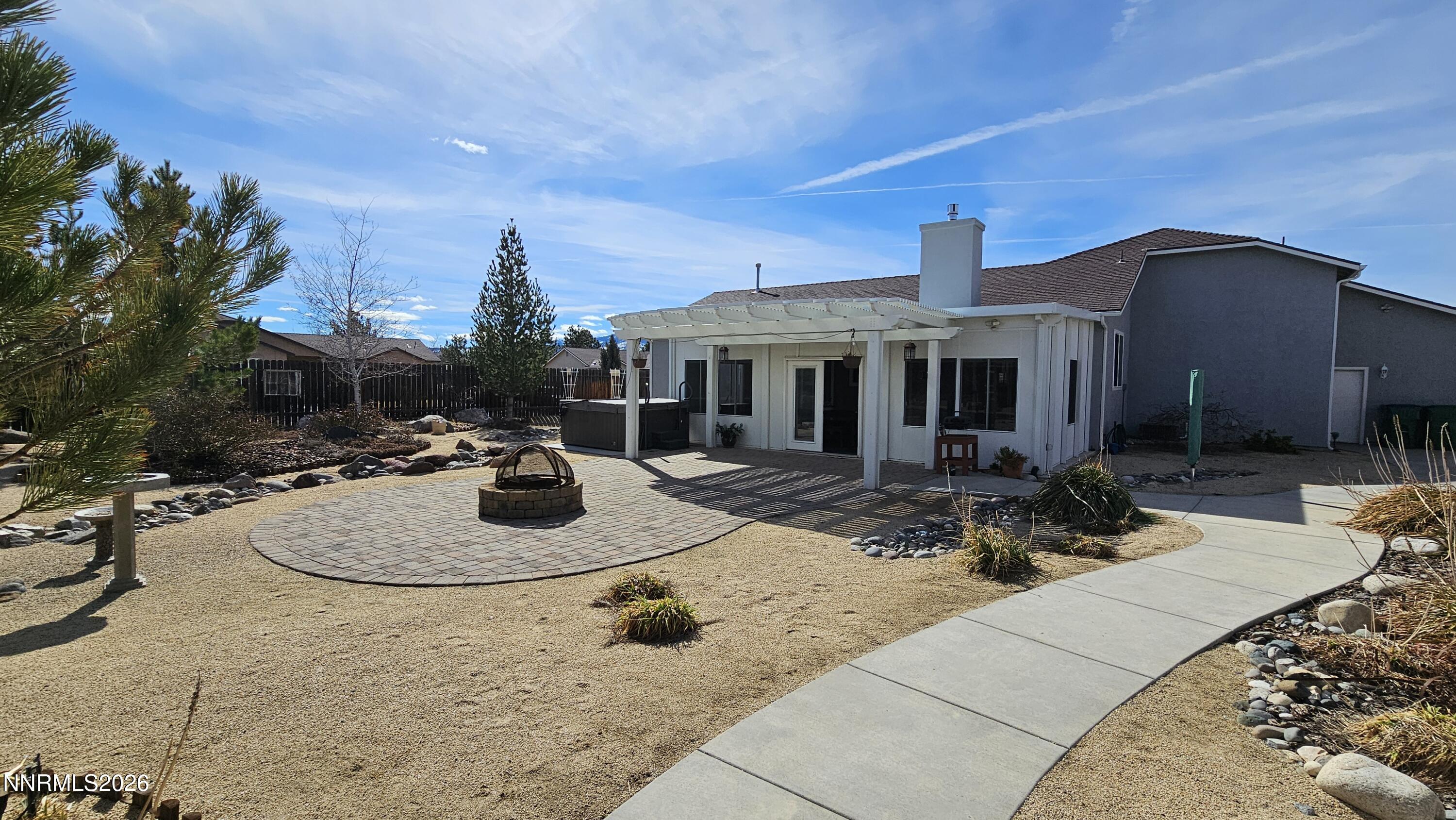 3933 Border Court Reno, NV 89508 - Photo 26 of 36 a view of a house with backyard and sitting area
