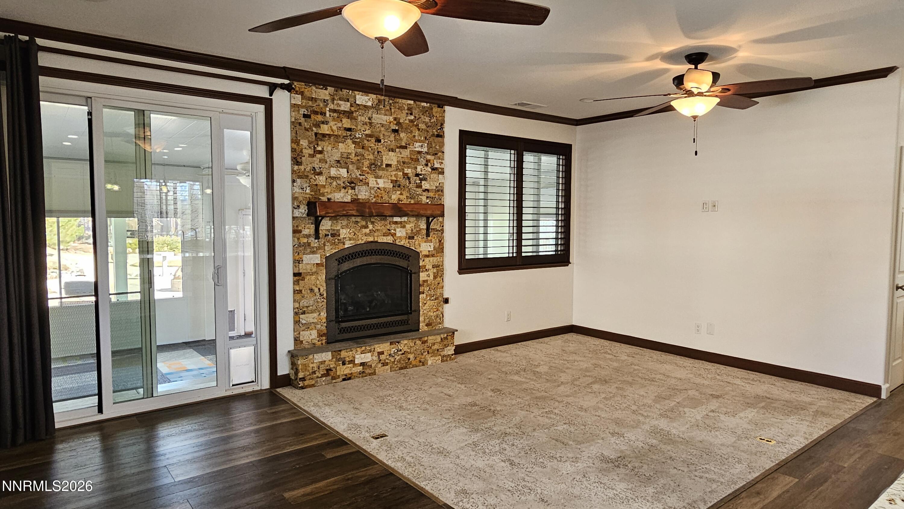 3933 Border Court Reno, NV 89508 - Photo 7 of 36 wooden floor fireplace and windows in an empty room