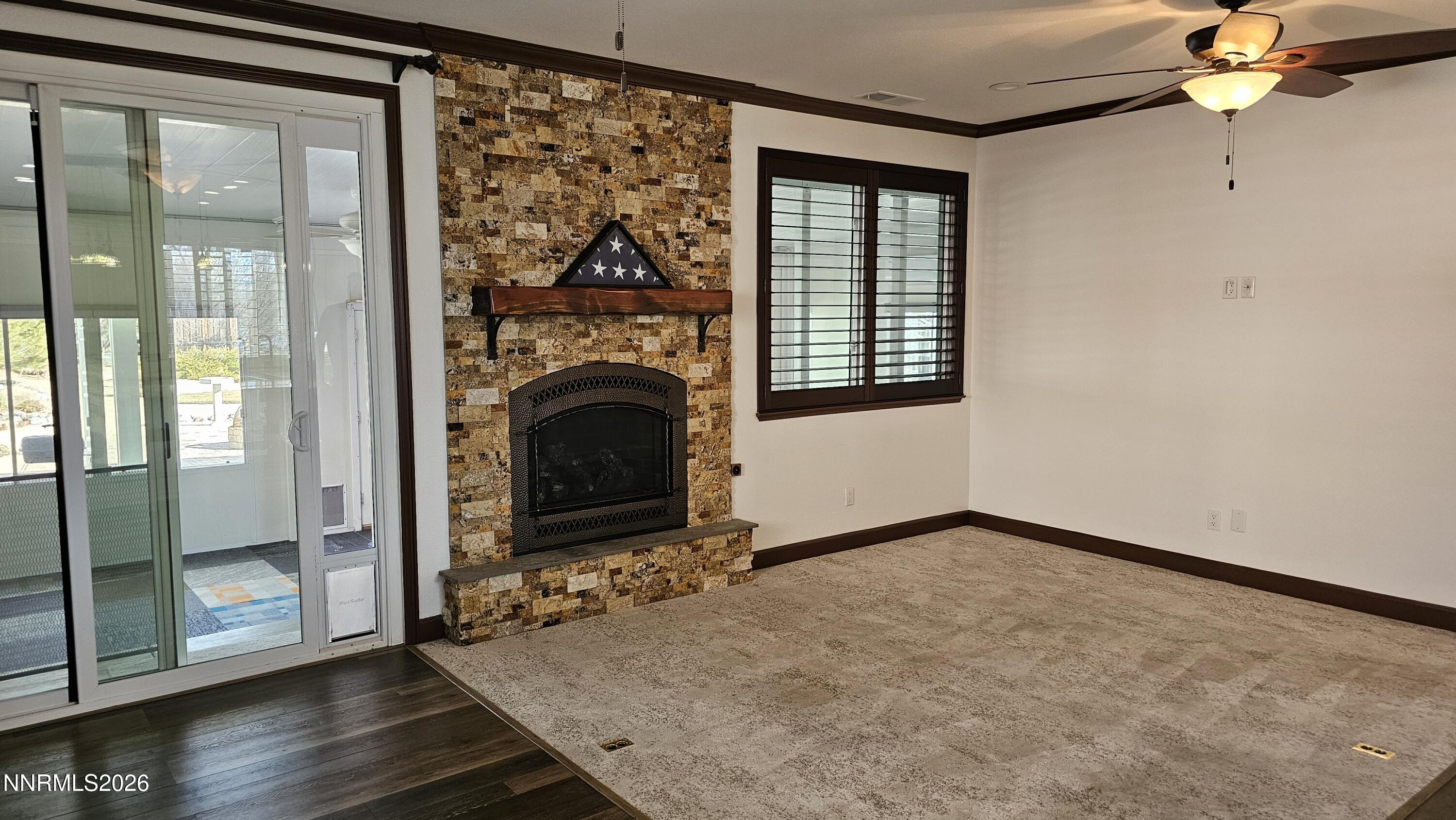 3933 Border Court Reno, NV 89508 - Photo 9 of 36 a view of a livingroom with a fireplace and window