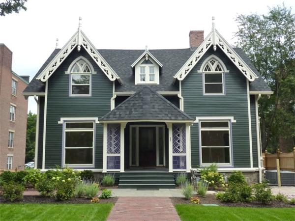 a front view of a house with garden