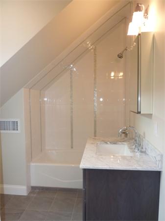 447 Washington Street, Unit 3 Brookline, MA 02446 - Photo 16 of 20 a bathroom with a sink and a mirror