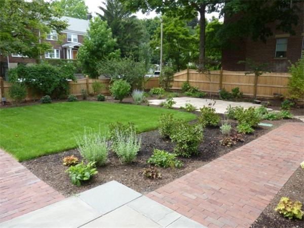 447 Washington Street, Unit 3 Brookline, MA 02446 - Photo 19 of 20 a view of a garden with a fountain
