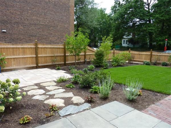 447 Washington Street, Unit 3 Brookline, MA 02446 - Photo 20 of 20 a view of backyard with table and chairs and potted plants