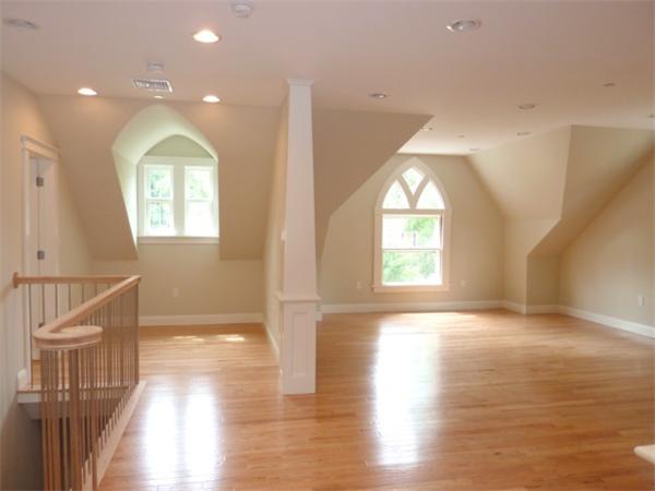 447 Washington Street, Unit 3 Brookline, MA 02446 - Photo 2 of 20 a view of empty room with wooden floor and fan