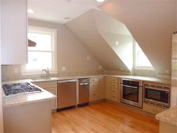 447 Washington Street, Unit 3 Brookline, MA 02446 - Photo 6 of 20 a kitchen with a stove and a microwave