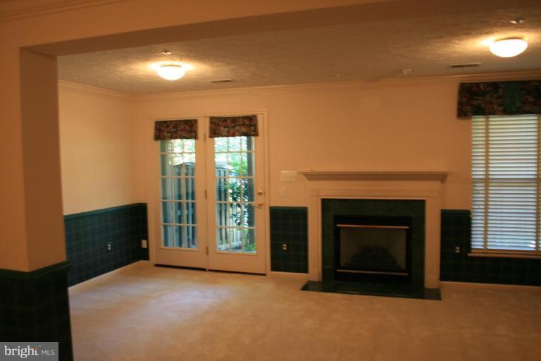 9502 Bellhaven Court Frederick, MD 21701 - Photo 11 of 24 a view of an empty room with a fireplace