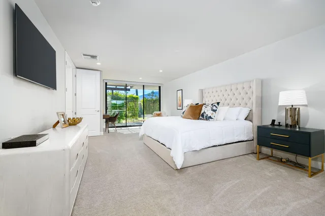 a bathroom with a double vanity sink toilet and shower