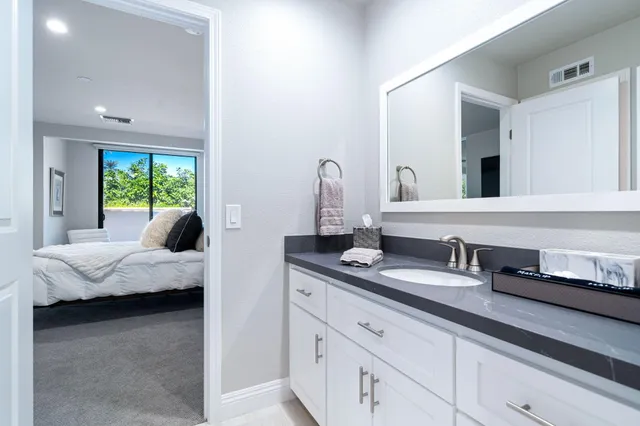 a view of a swimming pool with a patio