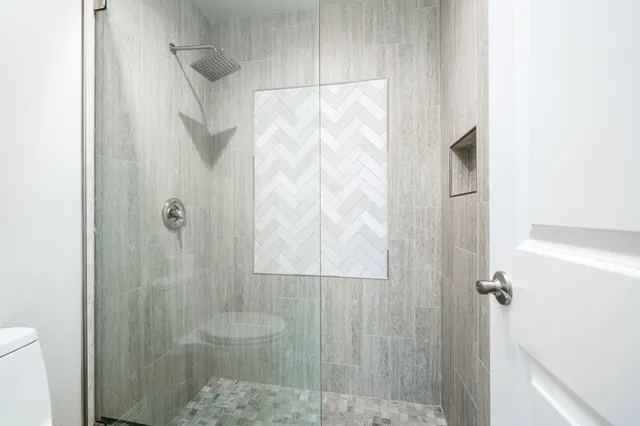 a view of a swimming pool with a patio