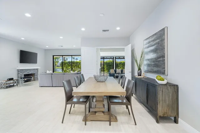 a view of a dining room with furniture window and outside view