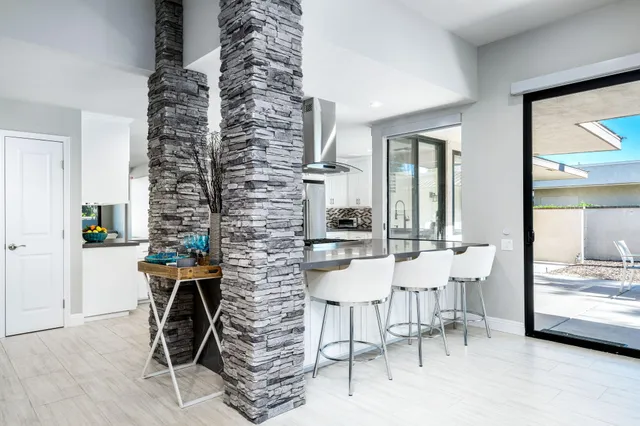 a view of a dining room with furniture window and outside view