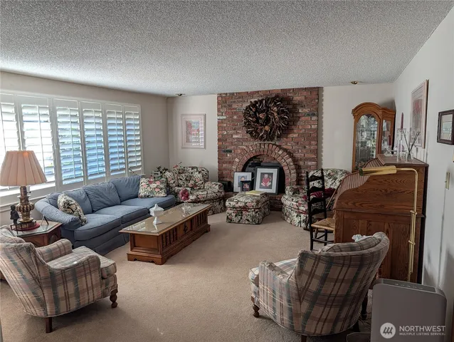 a view of a room with furniture and window