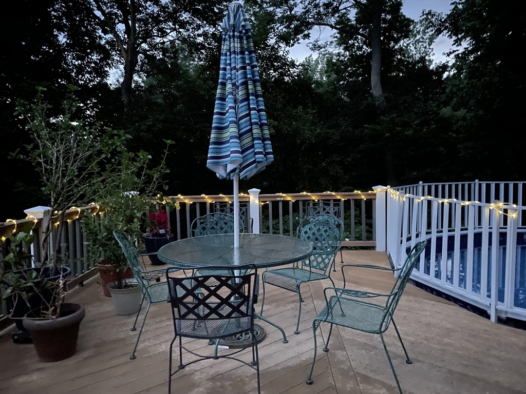 15 Riverside Drive Mansfield, MA 02048 - Photo 30 of 42 a backyard of a house with table and chairs