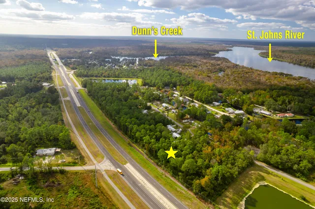 a view of a yard with a lake view