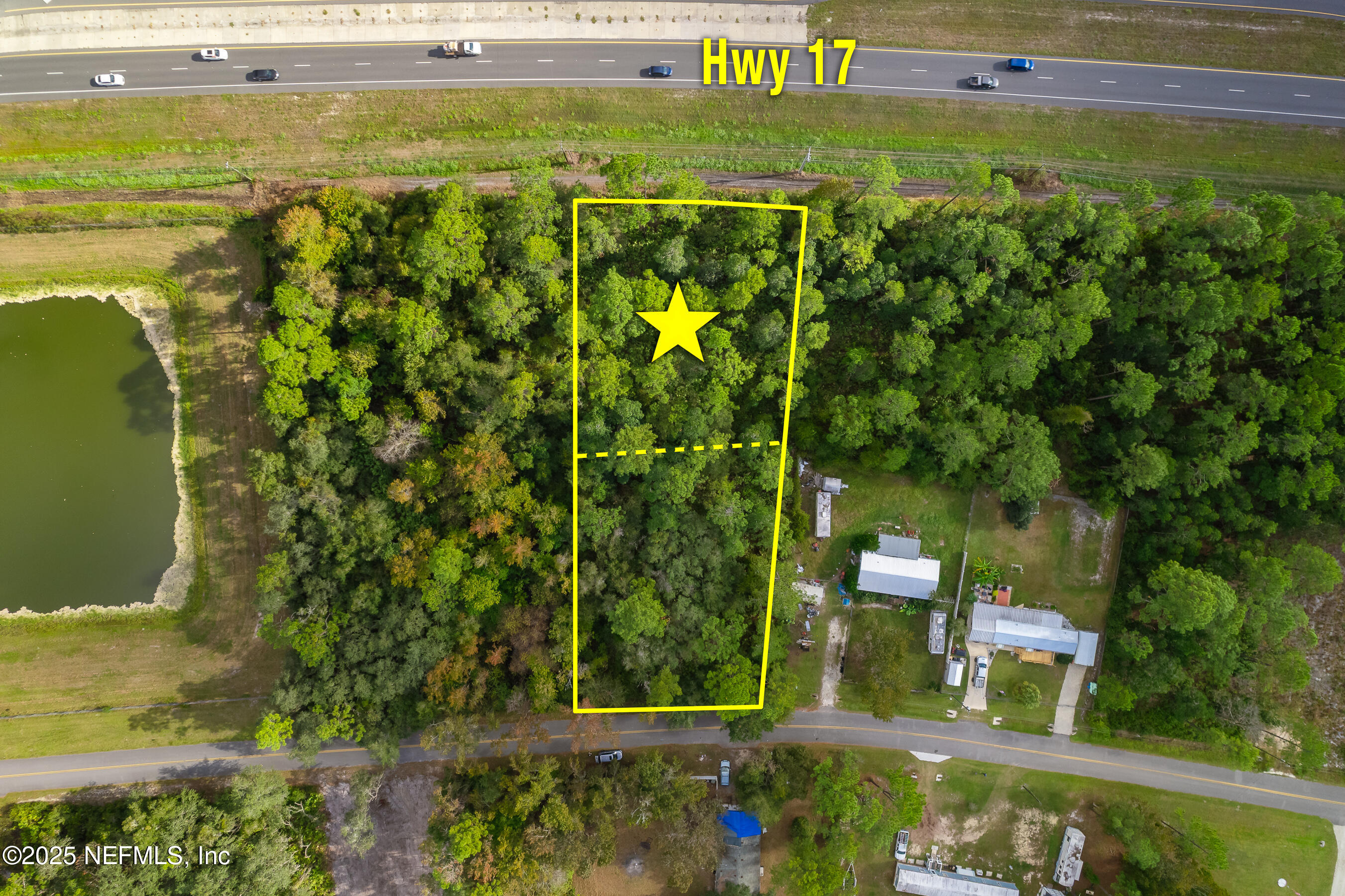 127 Landmark Avenue Satsuma, FL 32189 - Photo 7 of 14 a view of a yard with plants